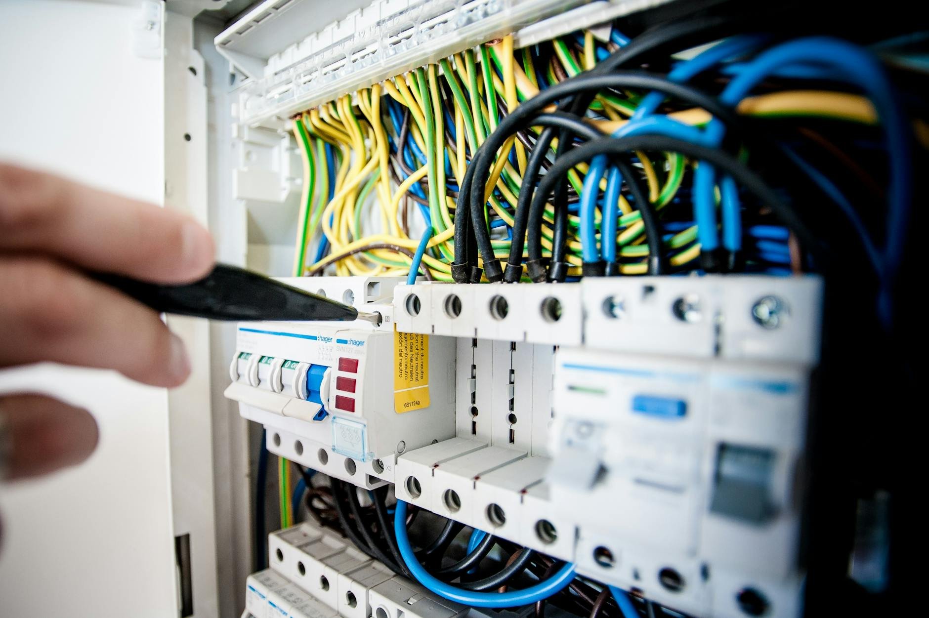 Professional electrical service technician working on a project